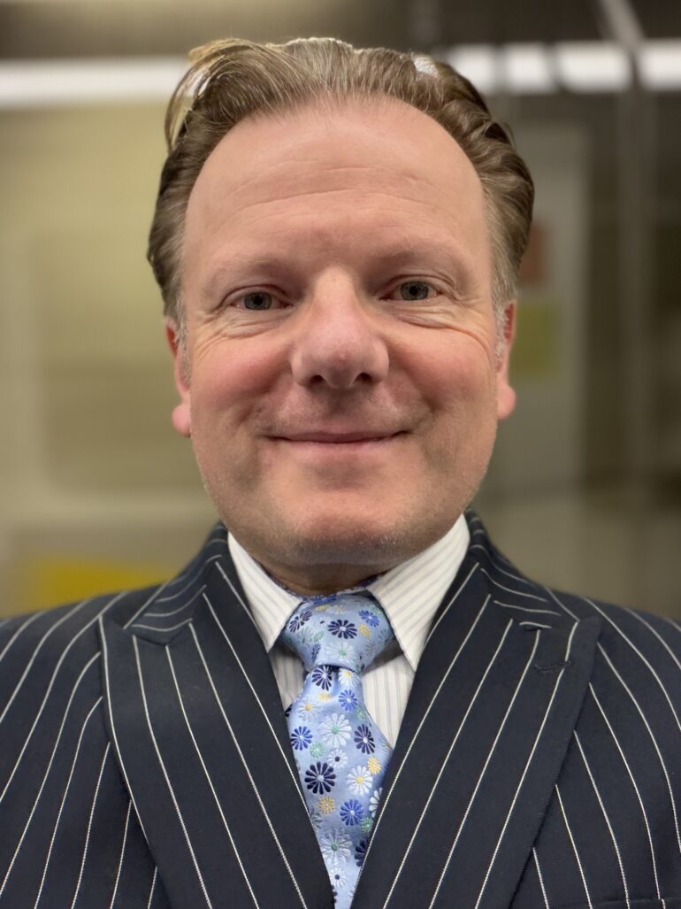 Nigel in a Striped Suit
